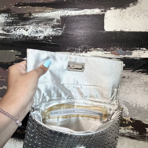 Clutch used silver evening bag with metallic design