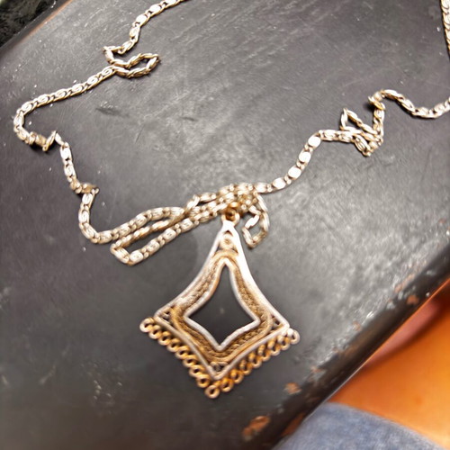 Silver vintage pendant with intricate chain