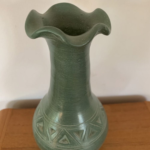 Handmade ceramic vase with carved geometric patterns, like new
