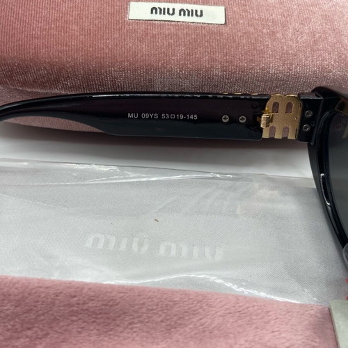 Miu Miu sunglasses new, black and gold for women
