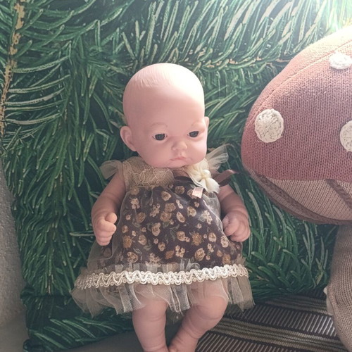 Doll with vintage dress
