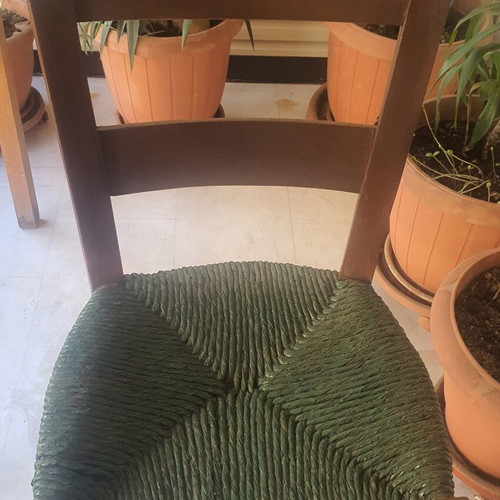 Wooden high chair with woven seat