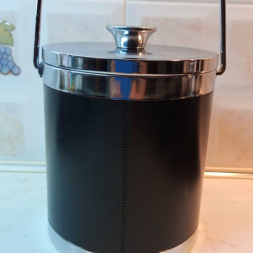 Vintage ice bucket with leather cover