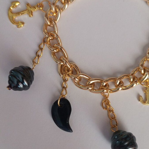 Gold bracelet with charms, new, dark blue details