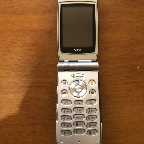 NEC 410i mobile phone used with charger and handsfree