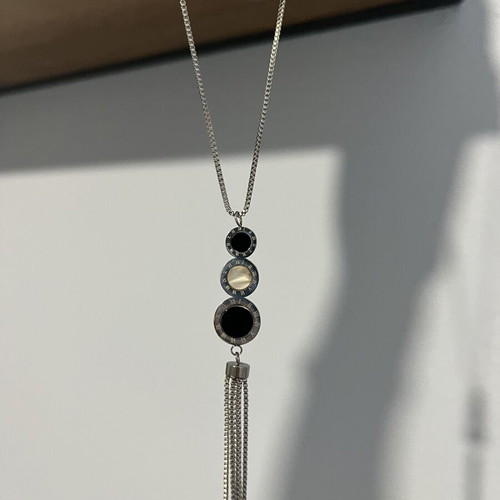 Long necklace with geometric design and tassel, black and silver
