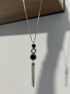 Long necklace with geometric design and tassel, black and silver