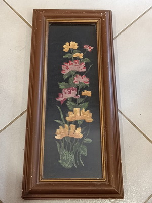 Vintage handmade embroidered textile painting in frame with glass