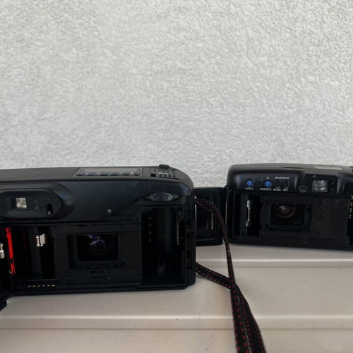 Olympus Super Zoom and Nikon Zoom Touch 600 cameras used
