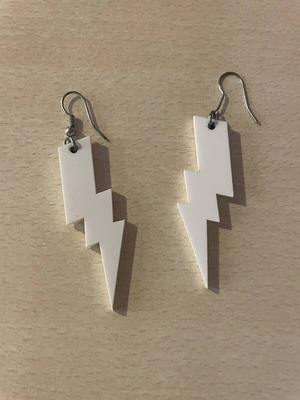 Lightning-shaped earrings like new, white
