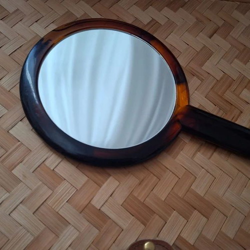 Double-sided handheld mirror, normal and magnifying