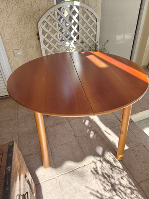 Wooden extendable round dining table used