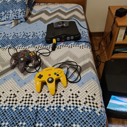 Nintendo 64 console used with jumper pack, power supply, cables, and two faulty controllers