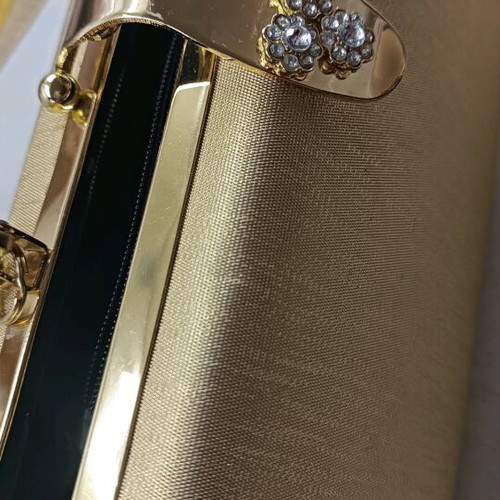 Gold evening handbag like new with missing rhinestone