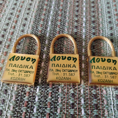 Keychains set of 3 used, gold tone, promotional children's clothing