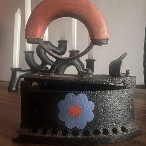 Cast iron charcoal iron used with painted flowers