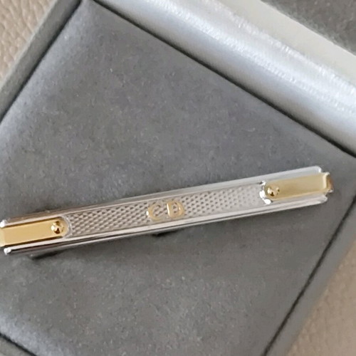 Authentic Dior tie pin new, silver with gold details
