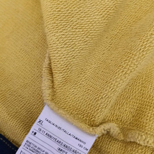 Benetton yellow jacket for 10 years like new
