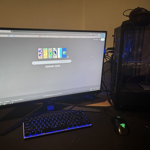Gaming setup with 2 monitors and peripherals