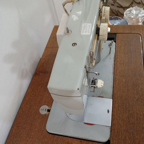 Russian Chaika Sewing Machine used with cabinet and accessories