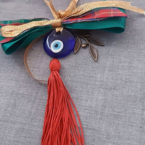 Glass eye charm with bronze olive branch and silk tassel, handmade