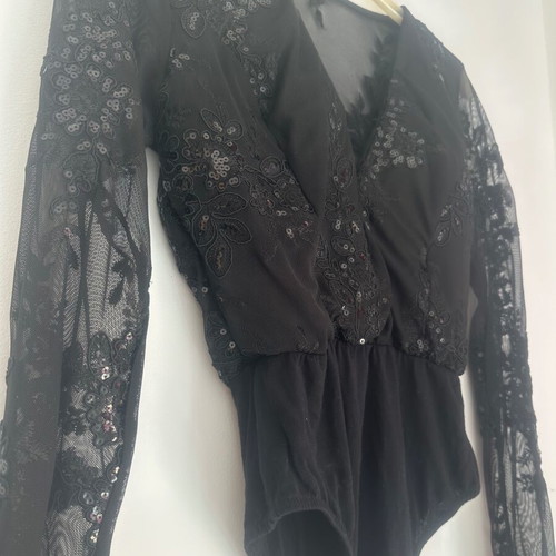 Black bodysuit with transparency and sequins size M like new