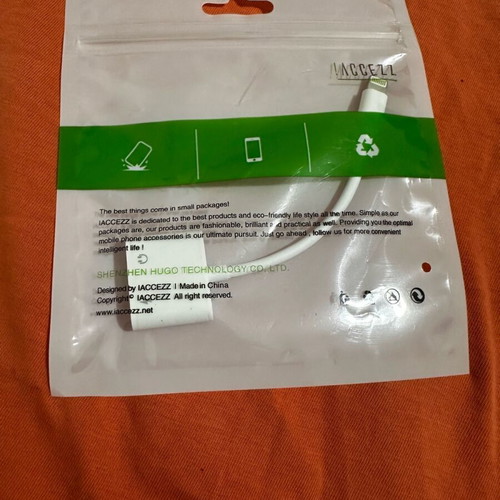 Apple adaptor new with 2 lightning ports for charging and music