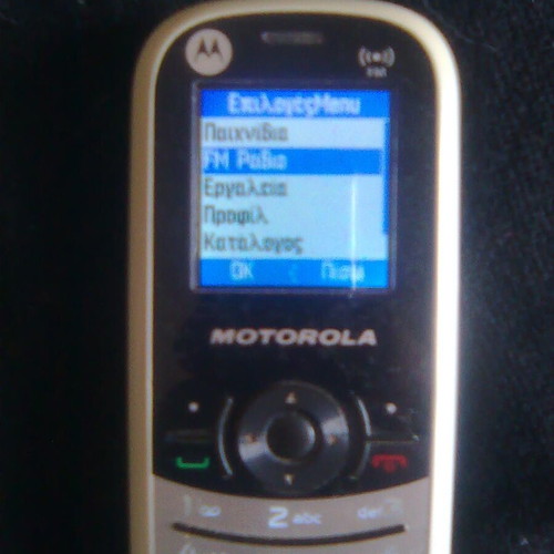 Motorola WX181 like new mobile phone with charger, headphones, and box