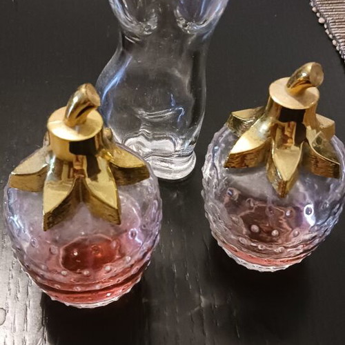 Various perfume bottles used, two with strawberry scent