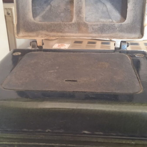 Cast iron stove used for briquettes and wood
