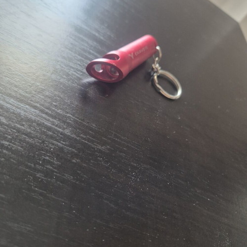Mini LED flashlight keychain with bottle opener like new, red