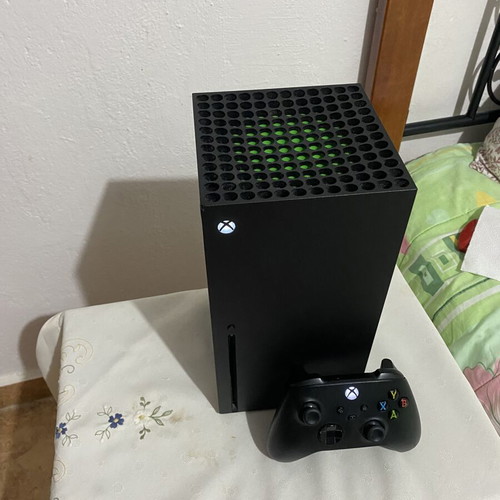 Xbox Series X console used with black wireless controller