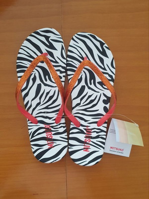 Mitsuko flip flops new with animal print and orange glitter