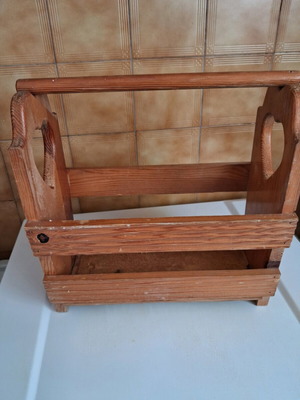 Wooden newspaper holder used for magazines and newspapers