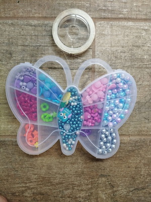 Colored beads used with thread, incomplete set