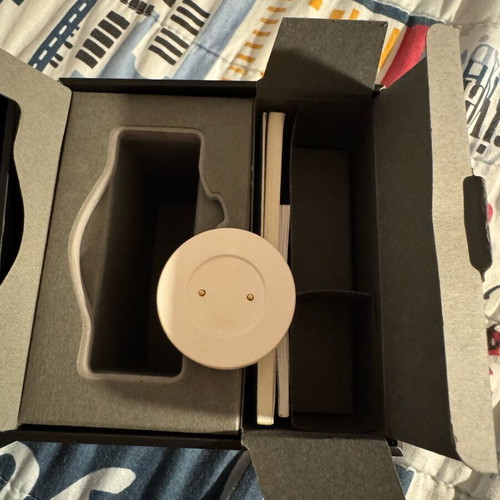 Huawei GT smartwatch used with charging base and fabric straps