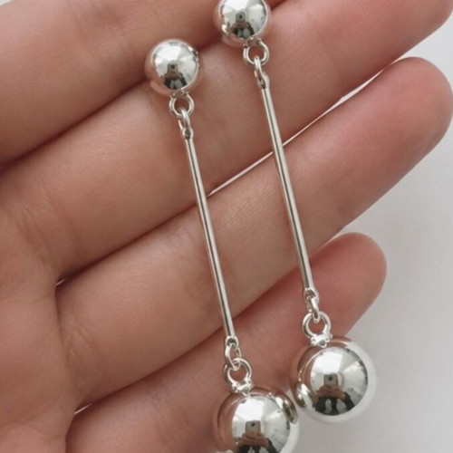Long geometric drop earrings with silver spheres