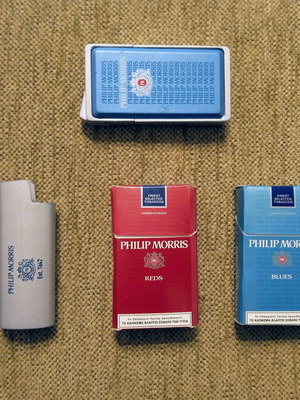 Philip Morris pack with metal lighter and 2 matchboxes like new