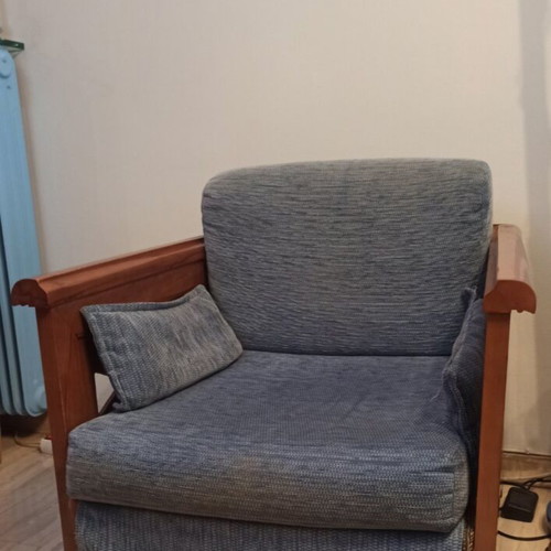 Wooden armchair with carved sides and back