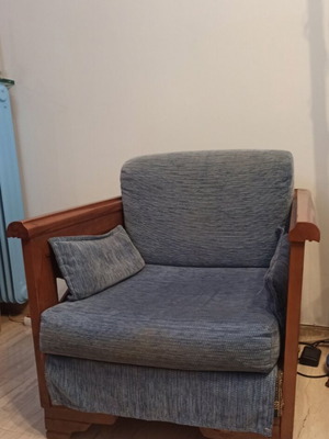 Wooden armchair with carved sides and back