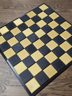 Chessboard in black and gold color, new