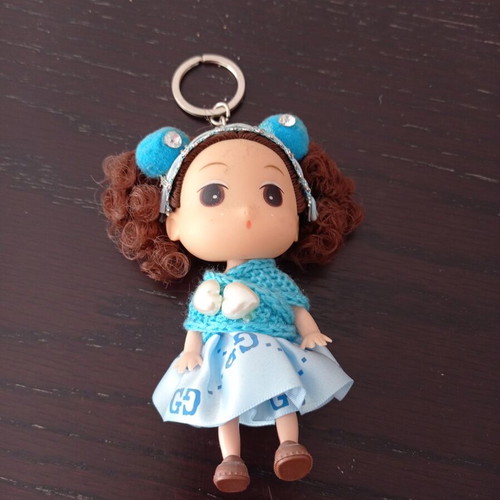 Keychain girl with blue clothes like new
