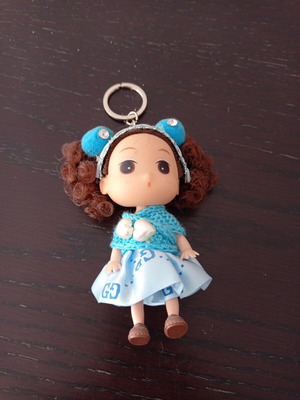 Keychain girl with blue clothes like new