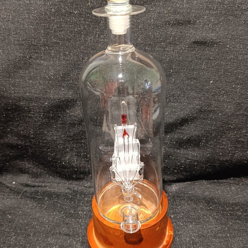 Vintage glass decanter with ship inside, used