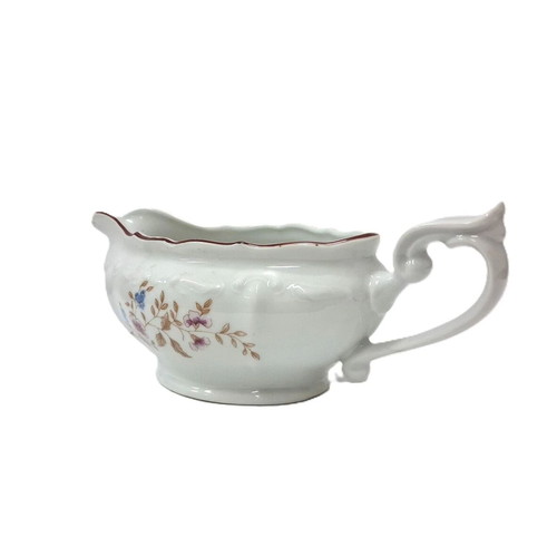 Vintage porcelain sauceboat with floral motif like new