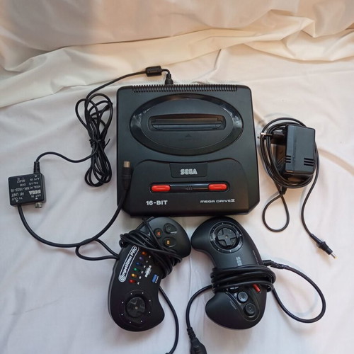 Sega Mega Drive 2 console used with 2 original controllers and cables
