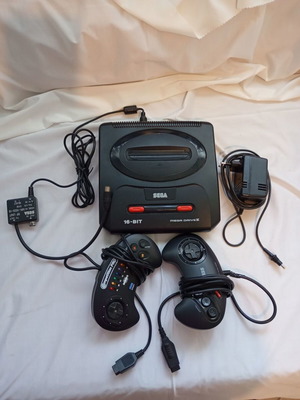 Sega Mega Drive 2 console used with 2 original controllers and cables