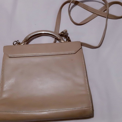 Handbag beige genuine leather used with metal details and lock