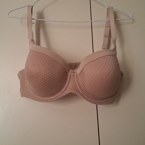 Beige bra new with small front tear