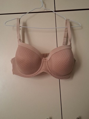 Beige bra new with small front tear